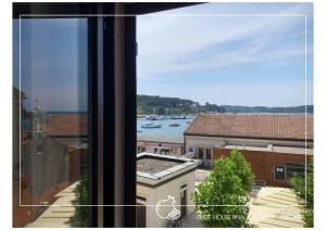 a view of a harbor from a window at Guest House Pina in Rovinj