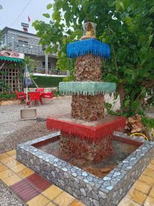 a fountain in the middle of a courtyard at Motel Ain Mersa in Ifrane