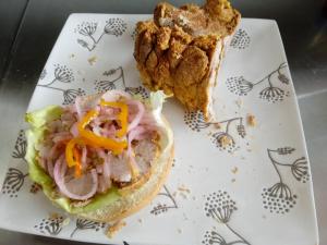 a sandwich and a piece of bread on a plate at Amazon Lodge Varillal in Iquitos