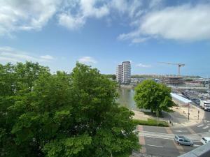a view of a river in a city at GOLDEN RESORT in Boulogne-sur-Mer