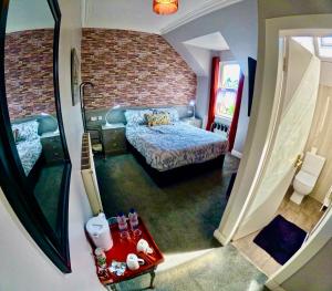 Postel nebo postele na pokoji v ubytování Hunters Guest House