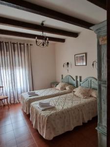 a bedroom with two beds in a room at Tio Claudio in El Barraco +25 photos