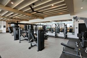 a gym with lots of treadmills and machines at Luxury West Midtown 2 bdrm in Atlanta
