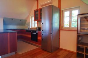 Köök või kööginurk majutusasutuses Chalet-Südsteiermark - traumhafte Aussicht, Infinity Pool, Privatsphäre, Klima und de-luxe Ausstattung