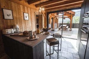 a kitchen with a large island in a house at Chalet de prestige Pyrénéen, 3 min des télécabines in Vignec