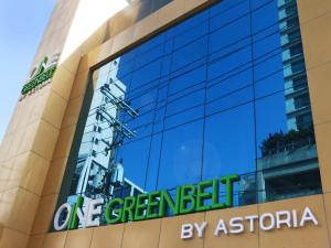 a sign on the side of a building at Astoria Greenbelt in Manila