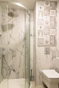 a bathroom with a shower and a toilet at ADIRAMA Apartments Elegant Apartments Walk to the Beach in Obzor +92 photos