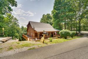 a house on the side of a road at Cozy Tennessee Lake House with Grill and Fire Pit! in Frogue