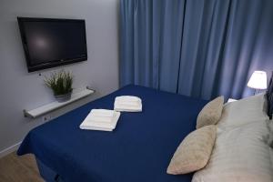 Postel nebo postele na pokoji v ubytování Riverside Dziwnów Apartament i SPA + 30 fotografií