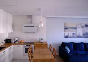 Kuchyň nebo kuchyňský kout v ubytování Riverside Dziwnów Apartament i SPA