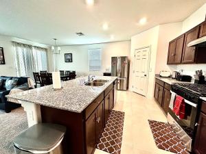 a kitchen with a sink and a counter top at Spacious House, 5 bedrooms, Sleeps 12, Near Las Vegas Strip and Airport in Las Vegas