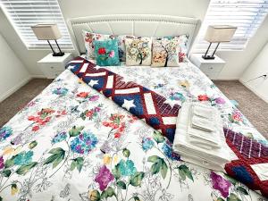a bed with an american flag quilt on it at NEW House, 2023 built, 5 bedrooms, Sleeps 12, Near Las Vegas Strip and Airport in Las Vegas