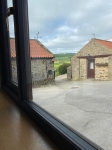 a view from a window of a building at Wagtail Cottage in Cloughton