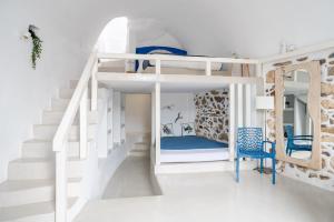 En eller flere senger på et rom på Fertimo Suites