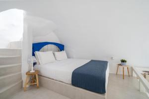 En eller flere senger på et rom på Fertimo Suites