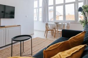 a living room with a couch and a table at Lisboa - Almirante Reis Central Apartment in Lisbon