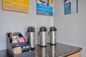 two silver thermopisks sitting on top of a counter at Motel 6-Sulphur, LA in Sulphur