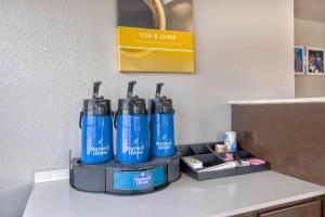 a group of blue water hydrants sitting on a counter at Motel 6-Falls Church, VA - Arlington Boulevard in Falls Church