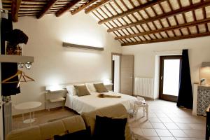 En eller flere senge i et værelse på Residence San Martino