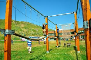 a group of people on a zip line at a park at Gaya Residences in Shahdag