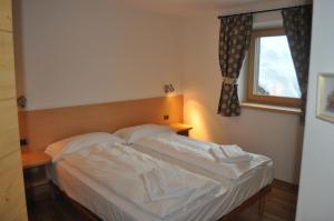 A bed or beds in a room at Chalet Elena