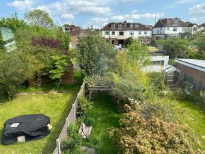 an aerial view of a garden with a fence at Comfortable Room in Upper Norwood