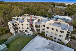 an aerial view of a white building at Rooftop Island Sunsets in Bongaree