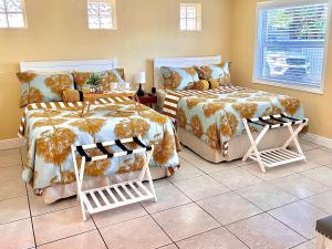 a bedroom with two beds and a window at Private Guest House in Miami