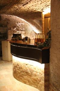 a kitchen with a counter with bottles of wine at Altstadtpalais im Sand in Bamberg