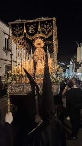 a person standing in front of a altar with candles at Laverdura in Ubrique