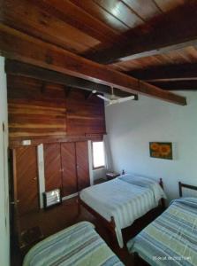 מיטה או מיטות בחדר ב-Quinta El Descanso