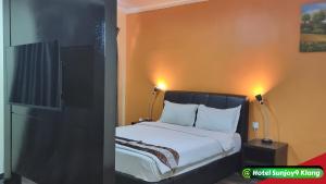 Voodi või voodid majutusasutuse Hotel Sunjoy9 Klang toas