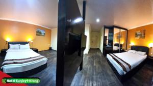 Voodi või voodid majutusasutuse Hotel Sunjoy9 Klang toas