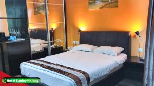 Voodi või voodid majutusasutuse Hotel Sunjoy9 Klang toas