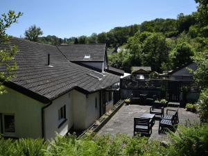 an overhead view of a house with chairs and a patio at Red Kite in Llanwinio