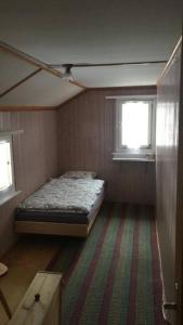 Postel nebo postele na pokoji v ubytování Ferienhaus in Graubünden