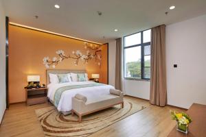 Voodi või voodid majutusasutuse Guangdong Hot Spring Hotel toas