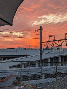a view of an airport with a sunset in the background at Guest House Kyoto Inn in Kyoto