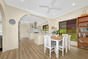 a kitchen and dining room with a table and chairs at The Loft at Scotts in Scotts Head
