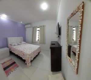 Postel nebo postele na pokoji v ubytování Hospedaria Casa de Maria