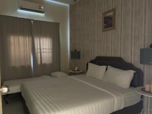 Postel nebo postele na pokoji v ubytování W House Ranong 1Bedroom villa
