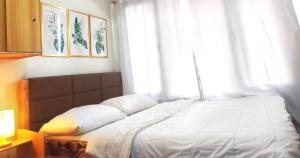 Tempat tidur dalam kamar di MEBO Lux Stay