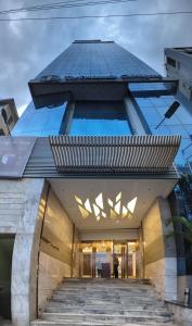 a building with a staircase leading up to it at The Peninsula Chittagong Limited in Chittagong