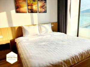 Giường trong phòng chung tại TMS Quy Nhơn Luxury Homestay