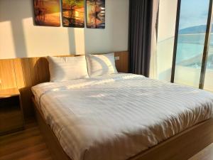 Giường trong phòng chung tại TMS Quy Nhơn Luxury Homestay