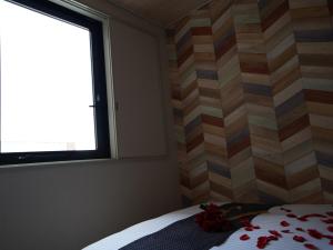 Postel nebo postele na pokoji v ubytování Hotel New Gaea Itoshima