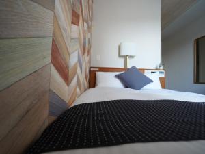 Postel nebo postele na pokoji v ubytování Hotel New Gaea Itoshima