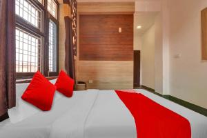 Voodi või voodid majutusasutuse Flagship Hotel Holiday Inn toas