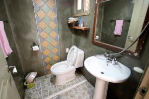 a bathroom with a toilet and a sink at Moran Guesthouse in Jeonju