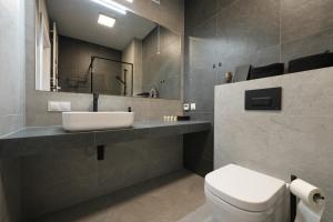 a bathroom with a sink and a toilet at Apartament Laguna Beskidów Parzenica z sauną i siłownią - Dream Apart in Zarzecze +21 photos